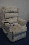 A FLORAL UPHOLSTERED RISE AND RECLINE ARMCHAIR (PAT pass and working)