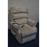 A FLORAL UPHOLSTERED RISE AND RECLINE ARMCHAIR (PAT pass and working)