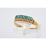 A YELLOW METAL TURQUOISE AND SEED PEARL RING, designed with a raised rectangular platform set with a