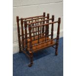 AN EDWARDIAN MAHOGANY CANTERBURY on brown ceramic casters width 40cm x depth 32cm x height 53cm