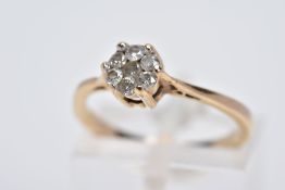 A 9CT GOLD DIAMOND CLUSTER RING, designed with a smaller cluster of seven brilliant cut diamonds,