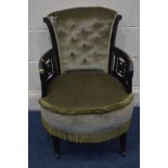 A LATE 19TH CENTURY EBONISED CIRCULAR ELBOW CHAIR with fretwork armrests on square tapering front