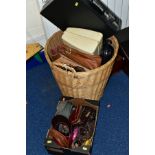 A WICKER BASKET CONTAINING, a Michael Kors branded handbag, vintage vanity case, leather messenger