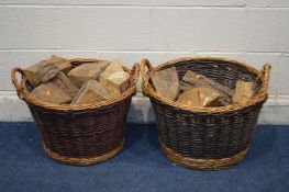 A NEAR PAIR OF CIRCULAR WICKER LOG BASKETS containing logs diameter 52cm