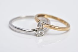 TWO SINGLE STONE DIAMOND RINGS, the first a 9ct white gold ring set with a round brilliant cut