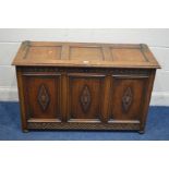 AN OAK TRIPLE PANEL BLANKET CHEST with brass hinges width 108cm x depth 44cm x height 67cm