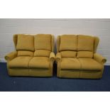 A GOLD UPHOLSTERED TWO PIECE LOUNGE SUITE comprising of two two seater settee's width 137cm
