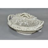 A LATE 19TH CENTURY BELLEEK PORCELAIN THREE STRAND FLORALLY ENCRUSTED WOVEN BASKET AND DOMED COVER