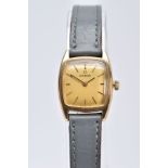 A LADIES 9CT GOLD OMEGA WRISTWATCH, of a square shape, gold tone dial signed 'Omega', baton markers,