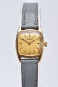 A LADIES 9CT GOLD OMEGA WRISTWATCH, of a square shape, gold tone dial signed 'Omega', baton markers,