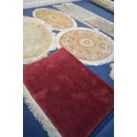 EIGHT VARIOUS RUGS include five various Chinese rugs or various shapes a large red rug etc (8)