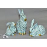 THREE HEREND RABBITS, all with green and white decoration, all modelled in different poses,