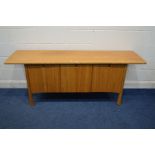 AN ERCOL SAVILLE BLONDE ELM SIDEBOARD the oversized top over two reed fronted cupboard doors