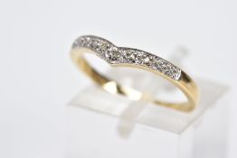 A 9CT GOLD DIAMOND RING, in the form of a wishbone, set with a row of five single cut diamonds,