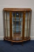 A 1940S WALNUT CHINA CABINET with two fixed glass shelves on ball and claw feet width: 100cm x