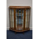 A 1940S WALNUT CHINA CABINET with two fixed glass shelves on ball and claw feet width: 100cm x