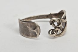 A VICTORIAN SILVER FORK BANGLE, a fiddle fork formed into a bangle with twist detailed prongs,
