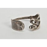 A VICTORIAN SILVER FORK BANGLE, a fiddle fork formed into a bangle with twist detailed prongs,