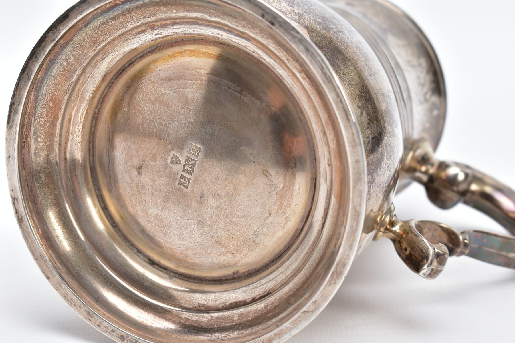A SILVER TANKARD, of a plain polished design, bell shaped body on a circular base with a foliate - Image 6 of 6