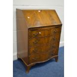 A REPRODUCTION MAHOGANY SERPENTINE BUREAU with a fitted interior above four drawers on bracket