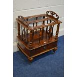 A REPRODUCTION BURR WALNUT CANTERBURY with fretwork decoration turned spindles single drawer on