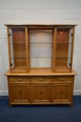 AN ERCOL ARLINGTON BLONDE ELM DISPLAY CABINET the top section with twin glazed cabinets and two