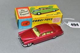 A BOXED CORGI TOYS JAGUAR MK X, No 238, metallic cerise body with lemon interior, spun hubs, two