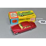 A BOXED CORGI TOYS JAGUAR MK X, No 238, metallic cerise body with lemon interior, spun hubs, two