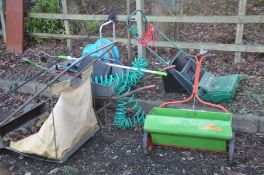A COLLECTION OF GARDEN TOOLS including a wheel barrow lawn raker lawn seeder a Qualcast lawn