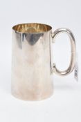 A SILVER TANKARD, of a plain polished design, engraved 'R.E.T 1945', hallmarked Sheffield 1944 '