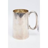 A SILVER TANKARD, of a plain polished design, engraved 'R.E.T 1945', hallmarked Sheffield 1944 '