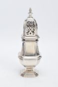 A SILVER GEORGIAN SUGAR SIFTER, plain polished design with an openwork cover, hallmarked London 1927