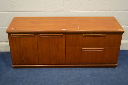 A MID 20TH CENTURY TEAK SIDEBOARD with double cupboard doors beside two drawer width 135cm x depth