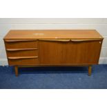 A MID TO LATE 20TH CENTURY TEAK SIDEBOARD flanked by three drawers width 153cm x depth 43cm x height