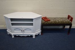 A MODERN WHITE CORNER UNIT width 120cm together with a modern window seat with a leopard print