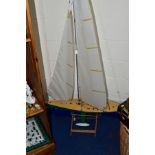 A REMOTE CONTROL POND YACHT OF PLASTIC CONTRUCTION WITH ALUMINIUM MAST, height including mast and