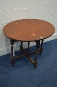 A MAHOGANY OVAL TOPPED COACHING TABLE (SD)