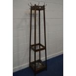 AN EARLY TO MID 20TH CENTURY OAK TAPERING SQURE HAT/COAT STAND with eight hooks and tin tray 41cm