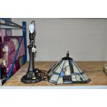 A MODERN TABLE LAMP WITH COLOURED GLASS LEADED SHADE, on a bronzed base, both shade and base have