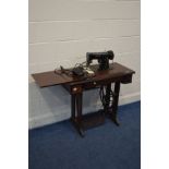 A SINGER TREADLE SEWING MACHINE with removable electric motor