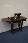 A SINGER TREADLE SEWING MACHINE with removable electric motor