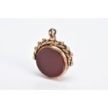 A 9CT GOLD SWIVEL FOB, of circular design swivels to reveal bloodstone and carnelian panels, to a