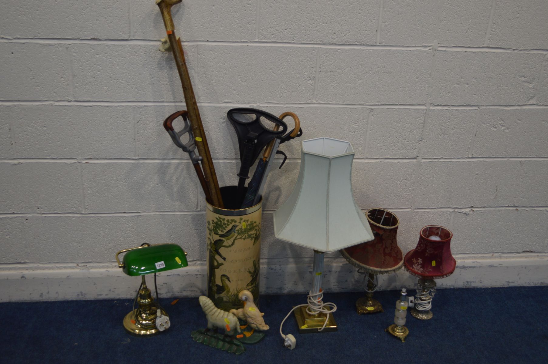 A BANKERS DESK LAMP together with a four various table lamp cylindrical umbrella stand with contents