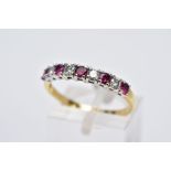 A YELLOW METAL RUBY AND DIAMOND HALF HOOP RING, designed with a row of claw set circular cut rubies,