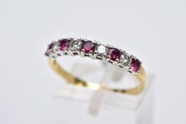 A YELLOW METAL RUBY AND DIAMOND HALF HOOP RING, designed with a row of claw set circular cut rubies,