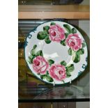 A WEYMSS WARE BREAD AND BUTTER PLATE PAINTED WITH PINK ROSES, bears blue printed T.Goode & Co