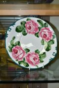 A WEYMSS WARE BREAD AND BUTTER PLATE PAINTED WITH PINK ROSES, bears blue printed T.Goode & Co