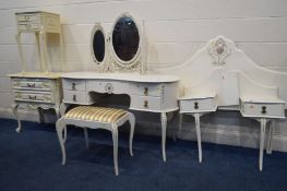 A MATCHED CREAM AND GILT BEDROOM SUITE, to include a kidney dressing table with a triple dressing