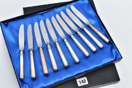 A SET OF TEN KNIVES, each of a plain polished designed with an engraved monogram to the handles,