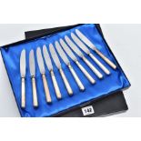 A SET OF TEN KNIVES, each of a plain polished designed with an engraved monogram to the handles,